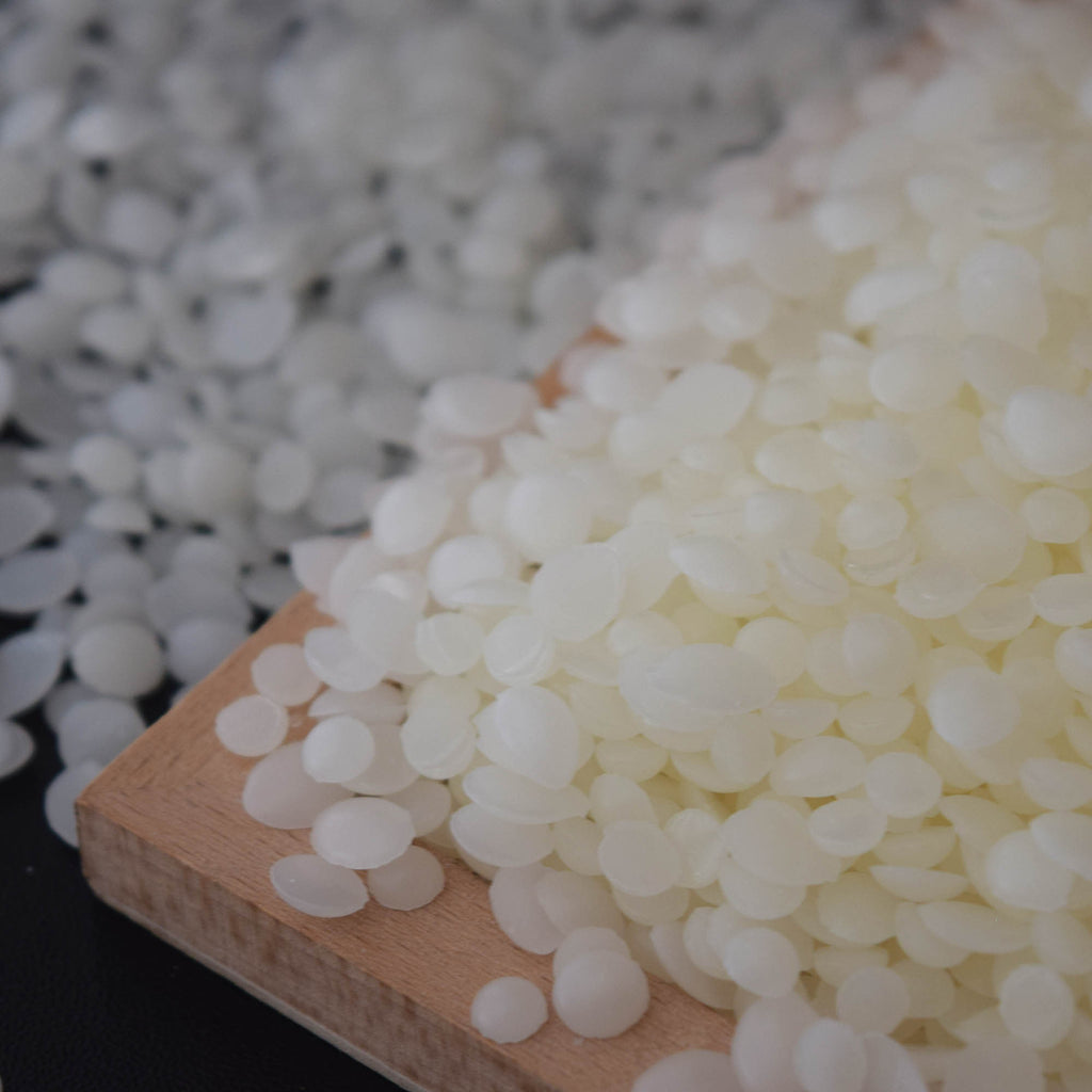 A professional-grade hard microcrystalline wax additive designed to improve candle hardness, surface gloss, and structural stability. Ideal for pillar, molded, and specialty candles.